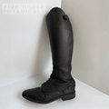 Black leather riding boot after cleaning on a white surface with 'Fire Horse Botanicals' branding.