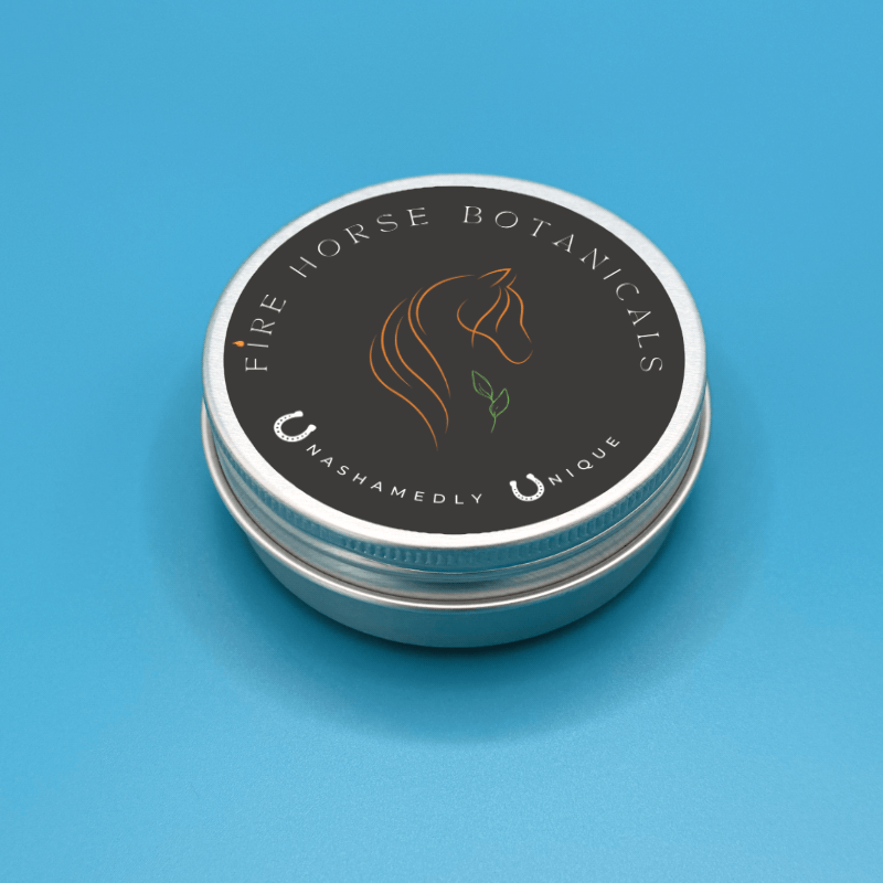 Tin container with 'Fire Horse Botanicals' label on a blue background