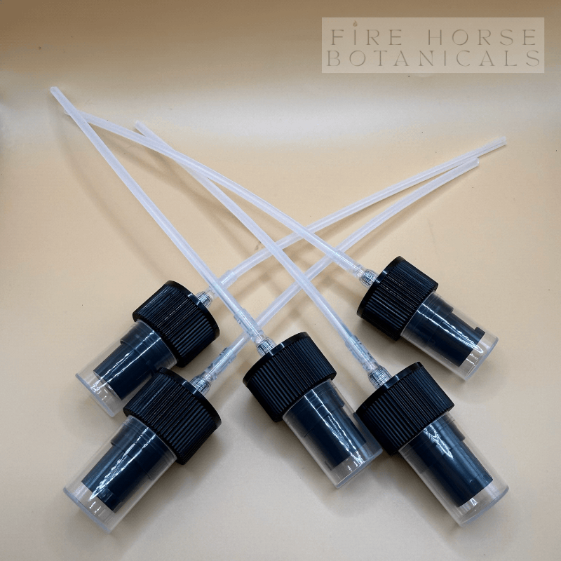 Set of pump nozzles for bottles  on a beige background, featuring 'Fire Horse Botanicals' branding.