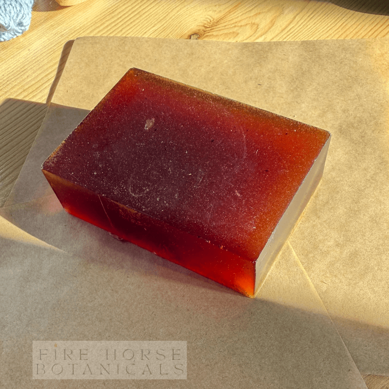 Bar 'Fire Horse Botanicals' soap on brown paper with 'Fire Horse Botanicals' branding.