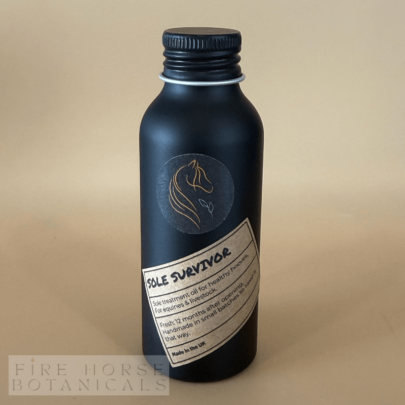 Black bottle with label on a beige background, featuring 'Fire Horse Botanicals' branding.